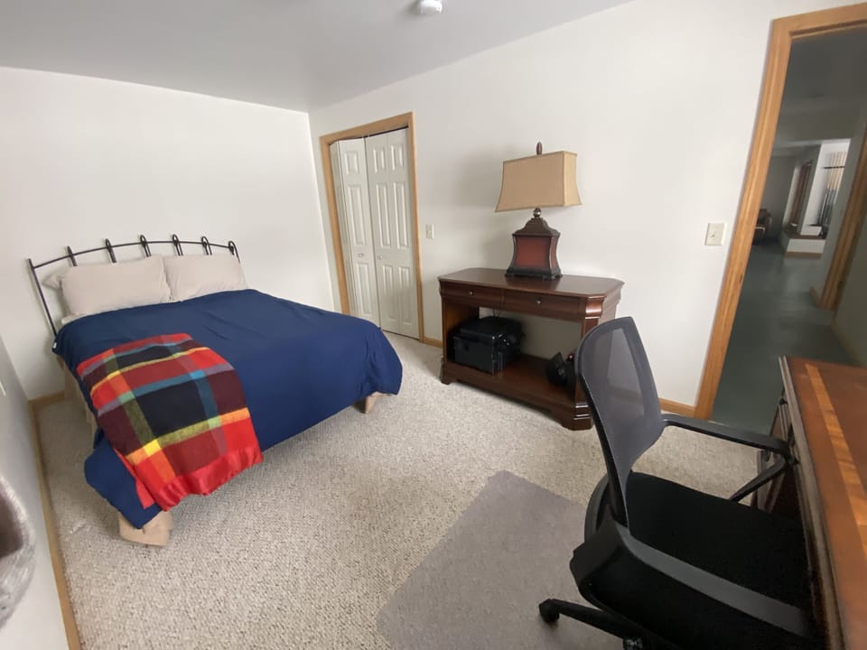 Office with double bed, facing lake.