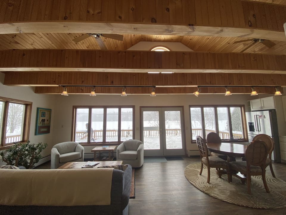 Open concept living/kitchen. Large Dining table not shown. Views of lake.