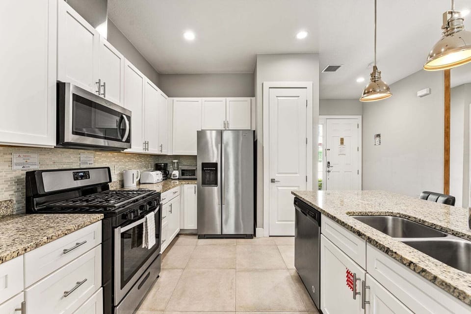 Enjoy cooking with sleek stainless steel appliances in a fully equipped kitchen.