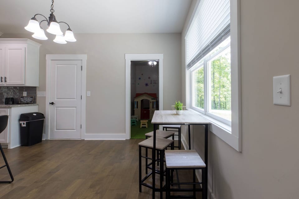 Here's a cute spot to hang out while the kids enjoy the playroom in the background.