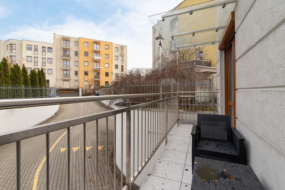 Another balcony shot, showcasing the neat exterior and surrounding residential space.

