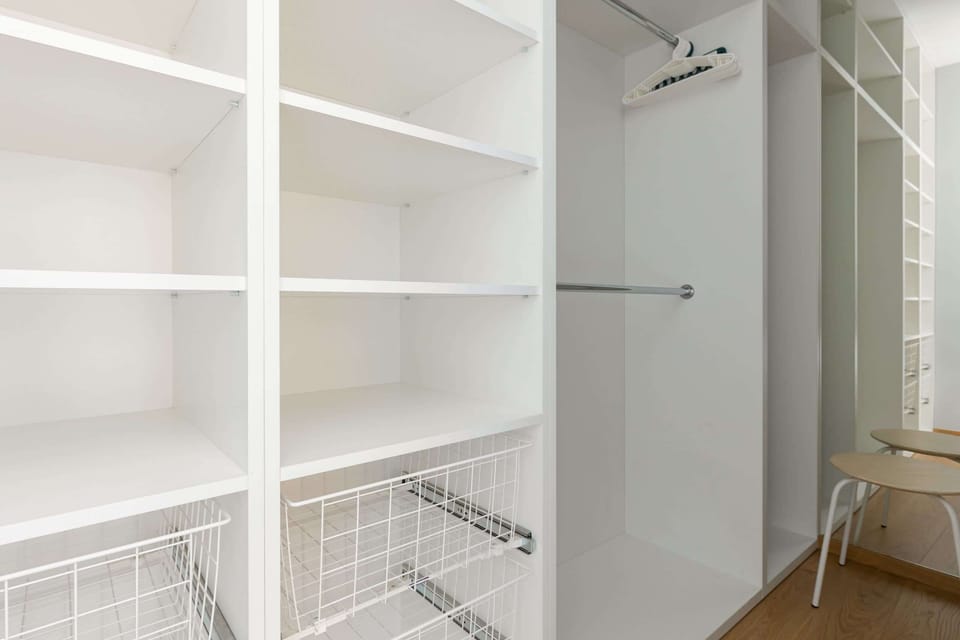 A spacious closet with built-in shelves and hanging space for all your belongings.

