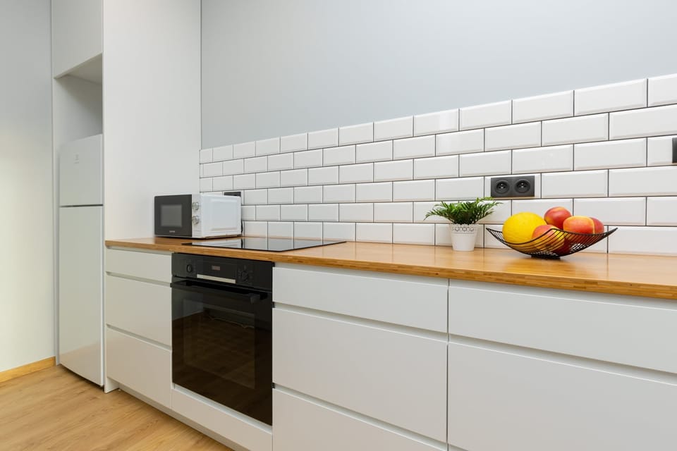 A cozy kitchen with modern appliances and plenty of counter space.

