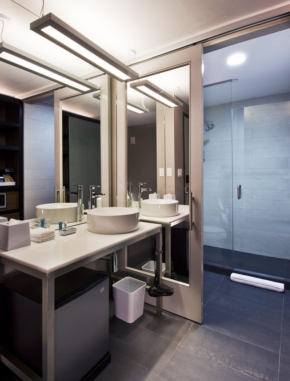 Shower, designer toiletries, hair dryer, towels