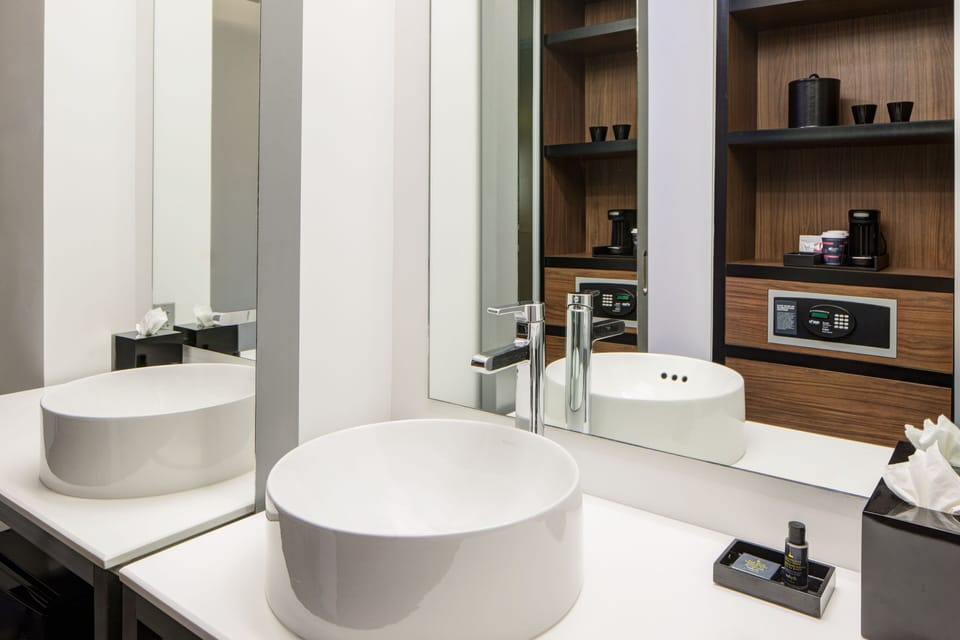 Shower, designer toiletries, hair dryer, towels