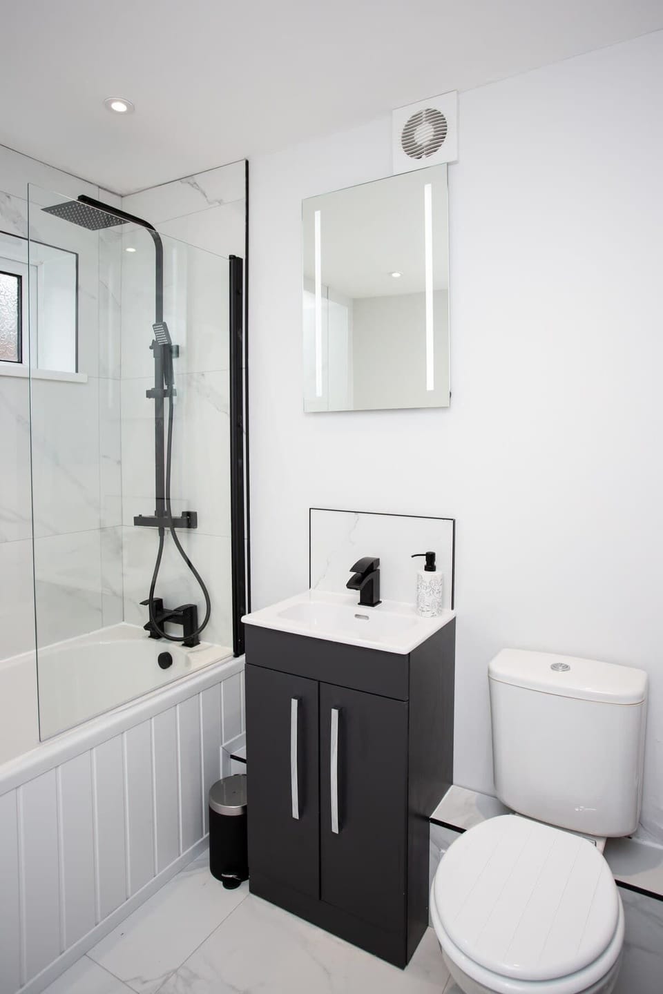  With ample storage space and elegant touches throughout, this bathroom is a sanctuary for relaxation and rejuvenation.