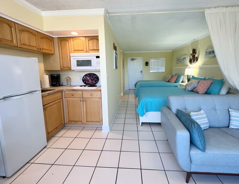 Kitchenette with fridge and freezer, coffee maker, two stove bur - Kitchenette with fridge and freezer, coffee maker, two stove burners, and convection microwave.
