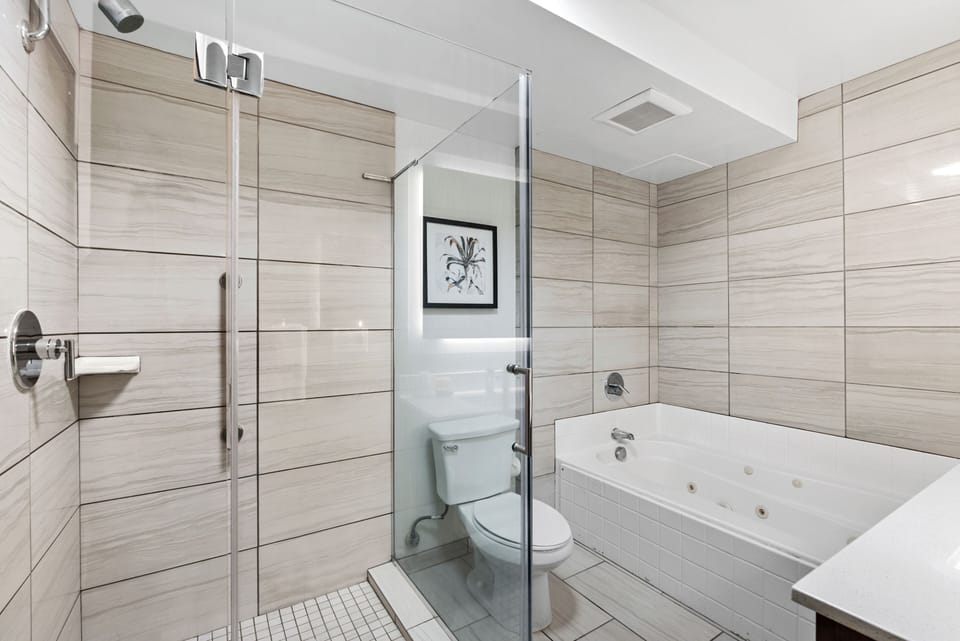 Standard Double Room, 2 Queen Beds | Bathroom | Combined shower/tub, free toiletries, hair dryer, towels