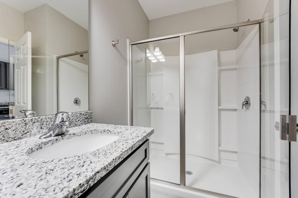 Large private bathroom with glass walk-in shower