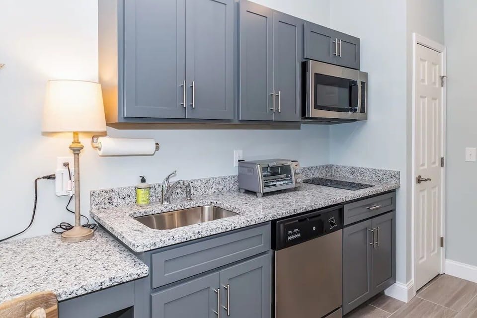 Dedicated work space, kitchen and closet.