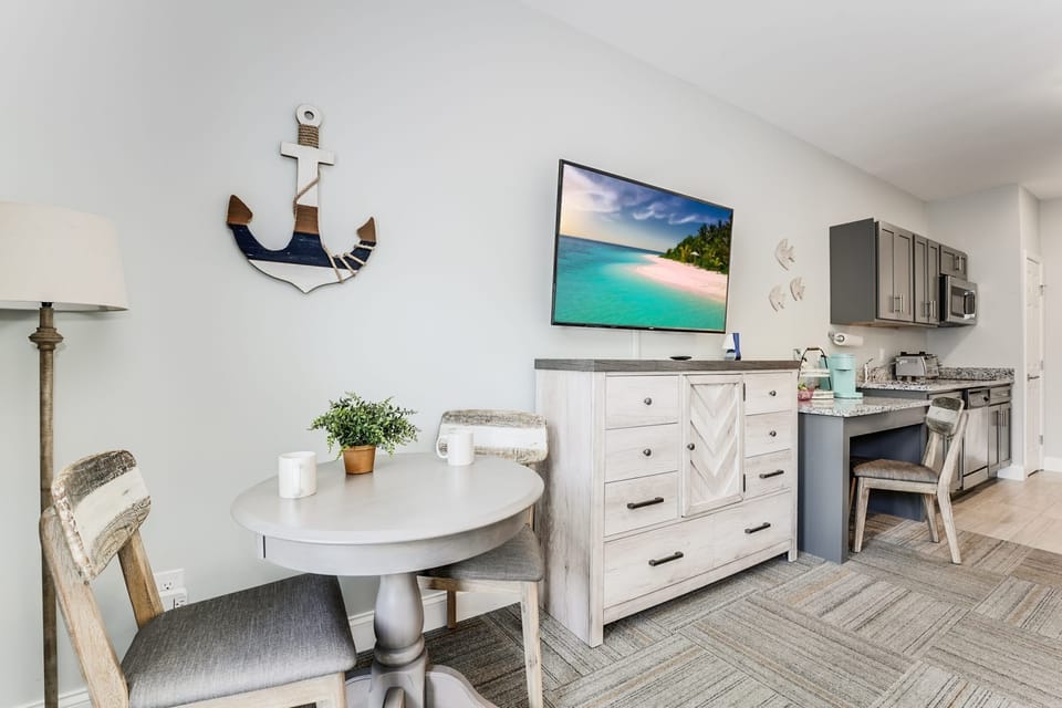 Dining table, smart tv, dresser and dedicated work space