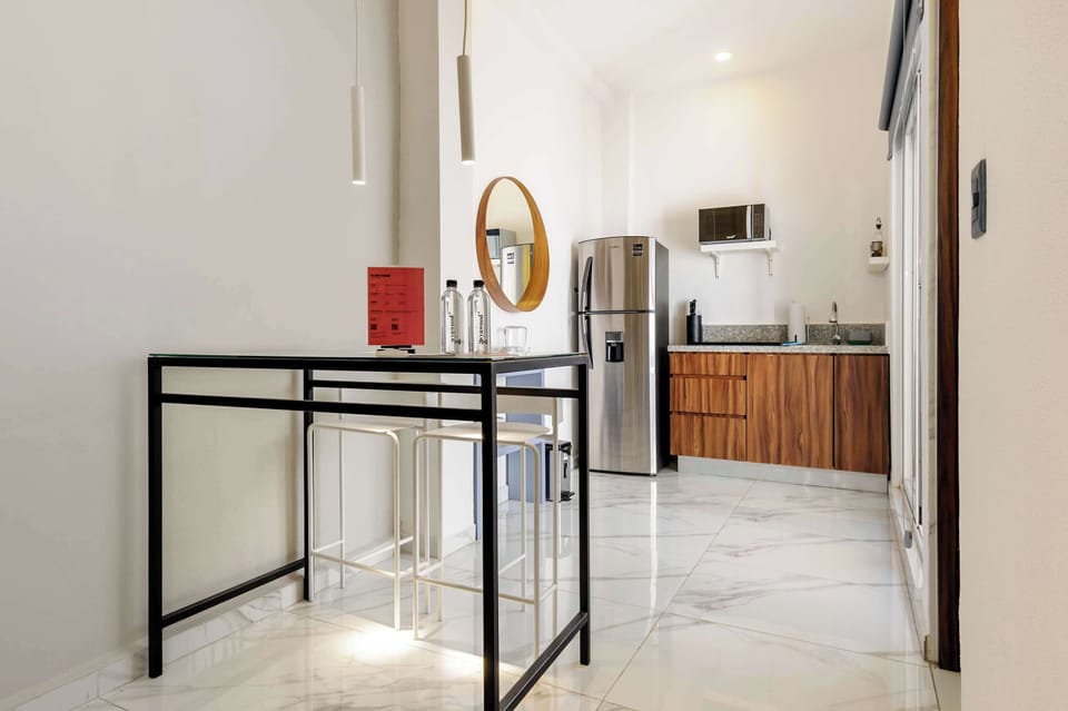 Modern dining area connected to the kitchen for a seamless stay experience.
