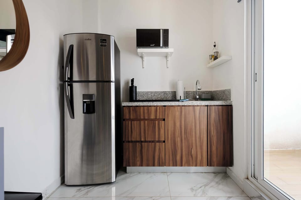 Spacious kitchen with sleek finishes and practical appliances for long stays.
