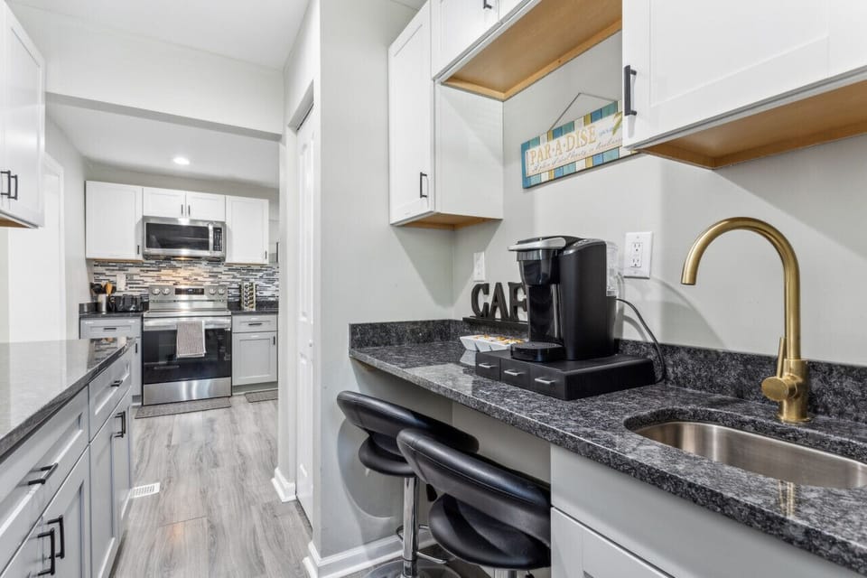 Drinks anyone? Coffee bar and extra sitting area in our custom designed Butler’s Kitchen