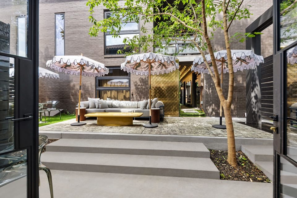 Peaceful courtyard moments surrounded by modern luxury and lush greenery
