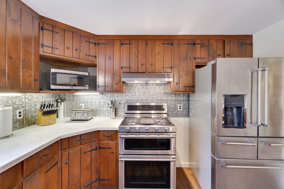 gas stove has 5 burners, dual convection oven- massive fridge w tons of storage