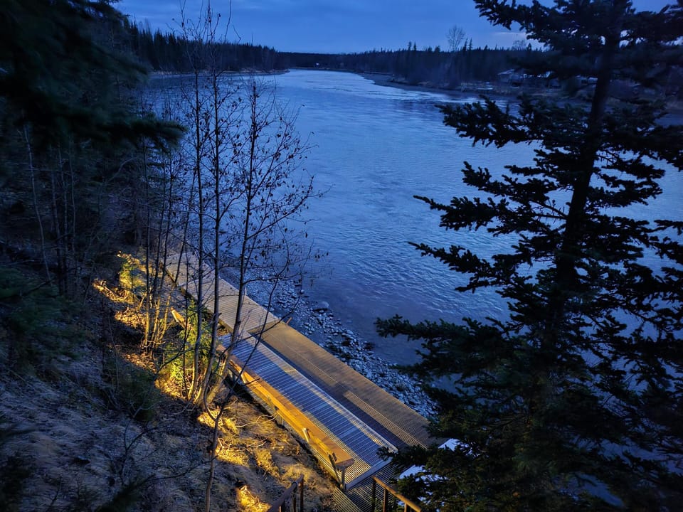 Cozy riverside patio with stunning twilight views