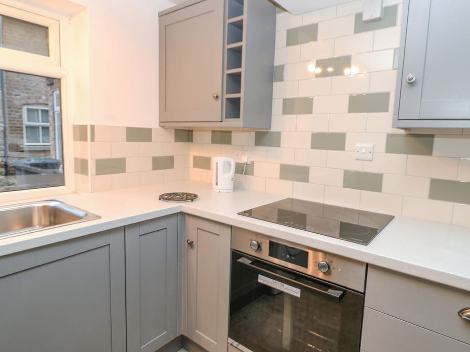 Fridge, electric kettle, toaster, cookware/dishes/utensils