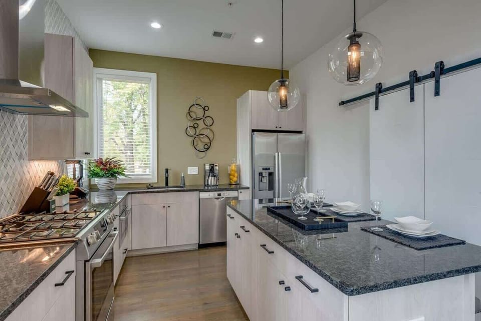 The heart of the home—a fully equipped kitchen with a massive island for group breakfasts and social hour.