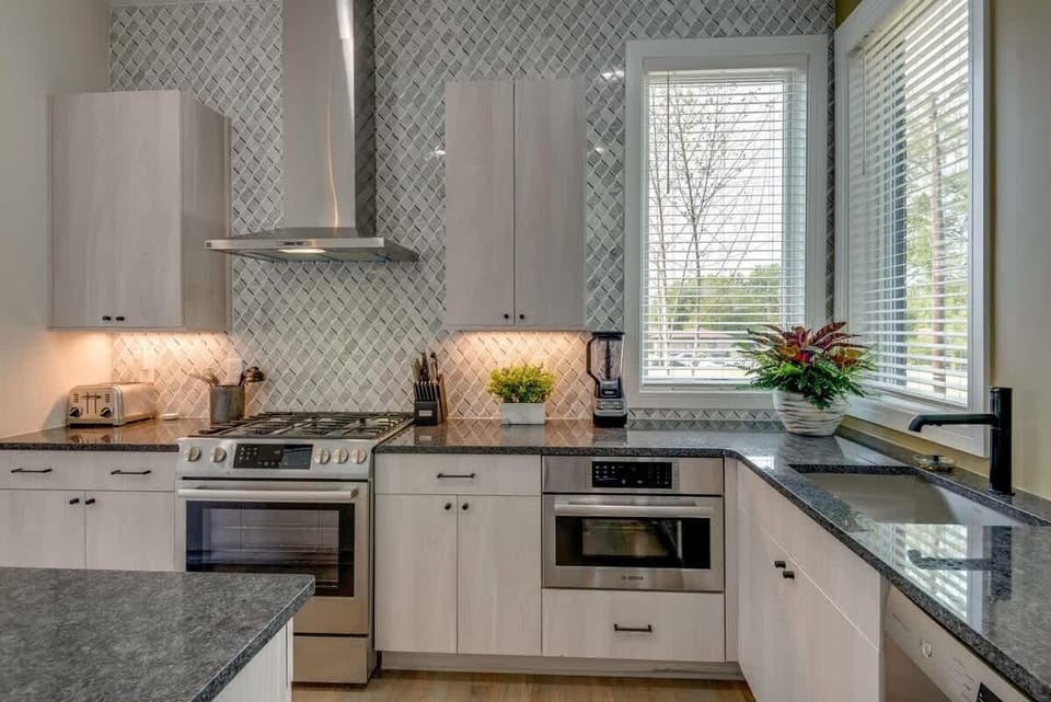 The heart of the home—a fully equipped kitchen with a massive island for group breakfasts and social hour.