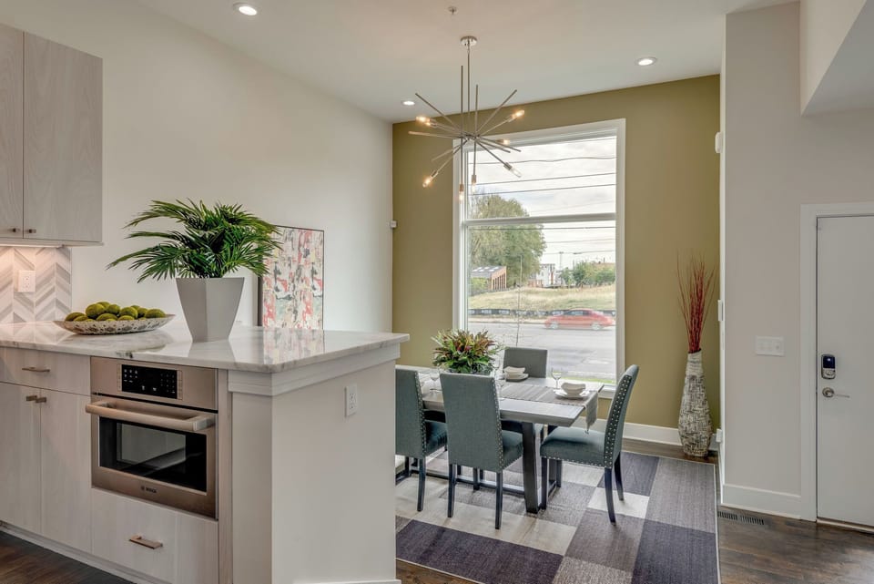 Gather the whole group for dinner with seating for 10 across the dining table and island.  