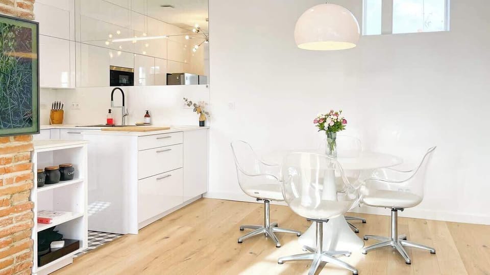Living room on the kitchen side, dining area.