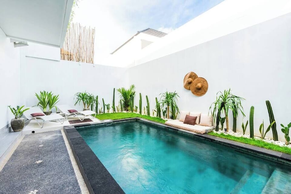 Cool off and take a dip in this stunning outdoor pool area! A perfect spot to relax and unwind.