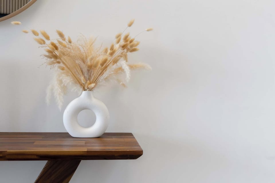 Minimalist console table styled w/ vase & dried grasses