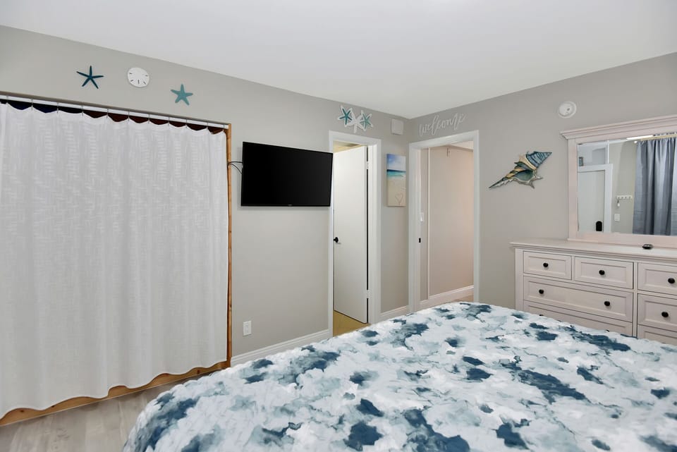 Bedroom with streaming TV and storage space