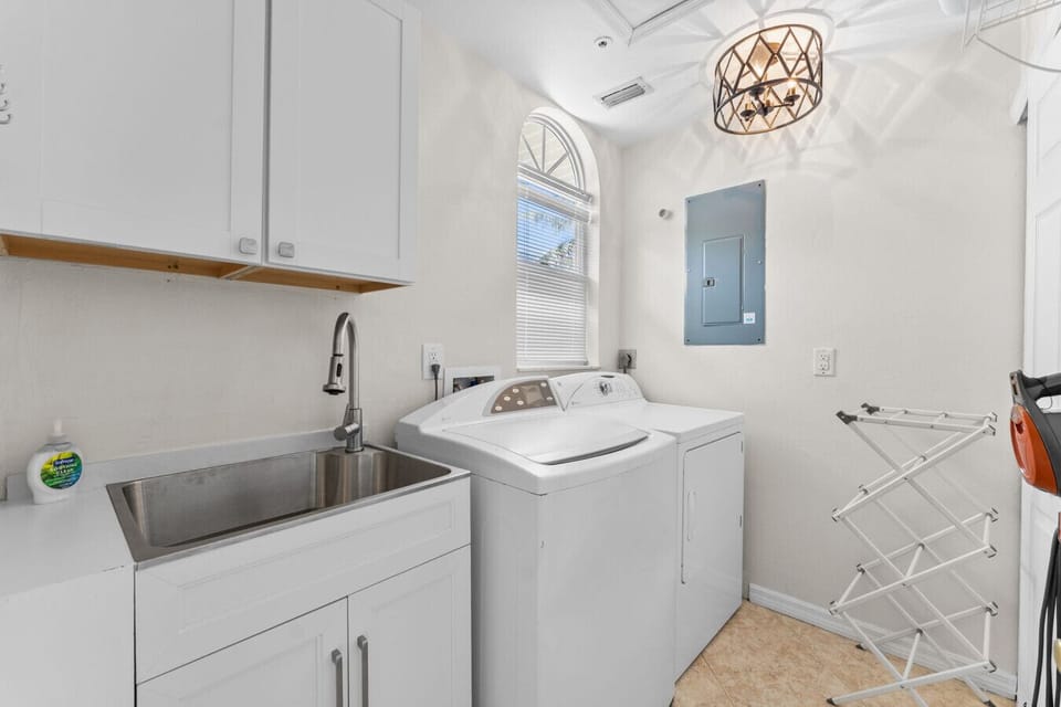 Pack light—full laundry room with washer, dryer & space to refresh