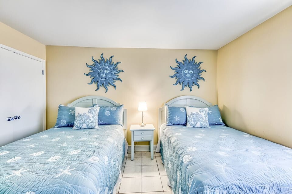 Two double beds in the front bedroom