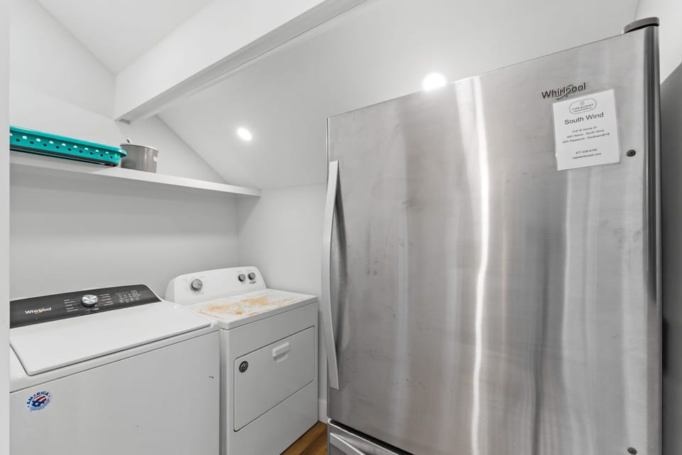 Your stay includes a well-equipped utility space with full-sized washer and dryer, plus a full refrigerator for keeping groceries fresh throughout your visit.