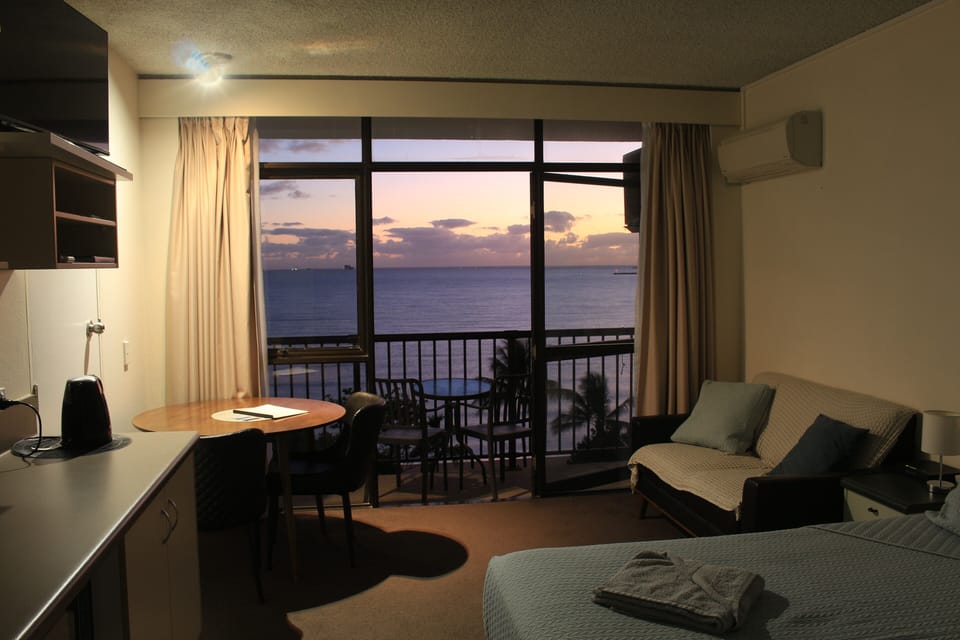 Evening out through the balcony from inside the unit.