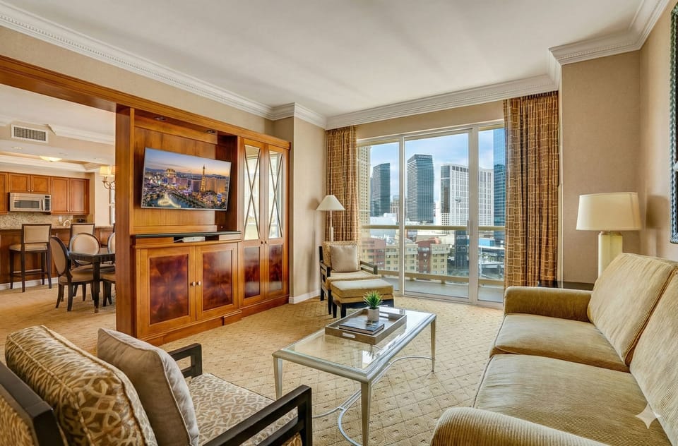 Spacious living room with floor-to-ceiling windows and skyline views! 
