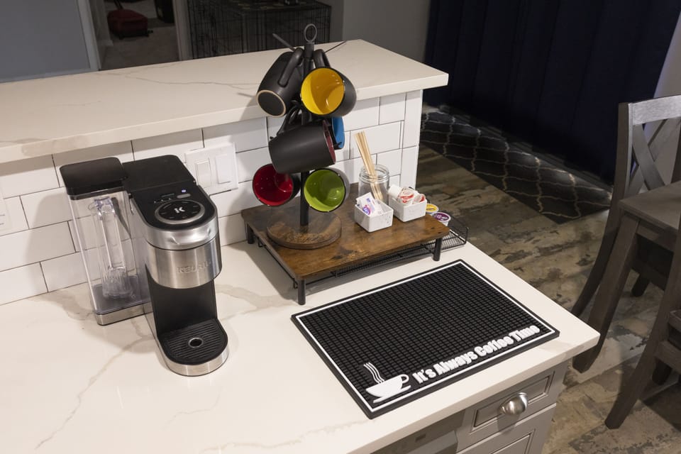 Start the morning right! Loaded coffee station with k-cups and all the mixers.