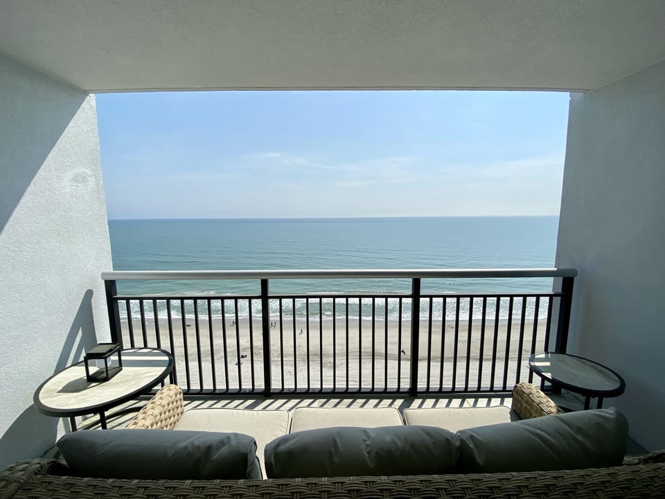 Comfy patio furniture to enjoy the incredible ocean views.