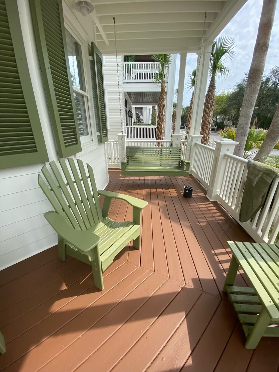 Front porch swing and Adirondack chairs where you can hear the waves crash