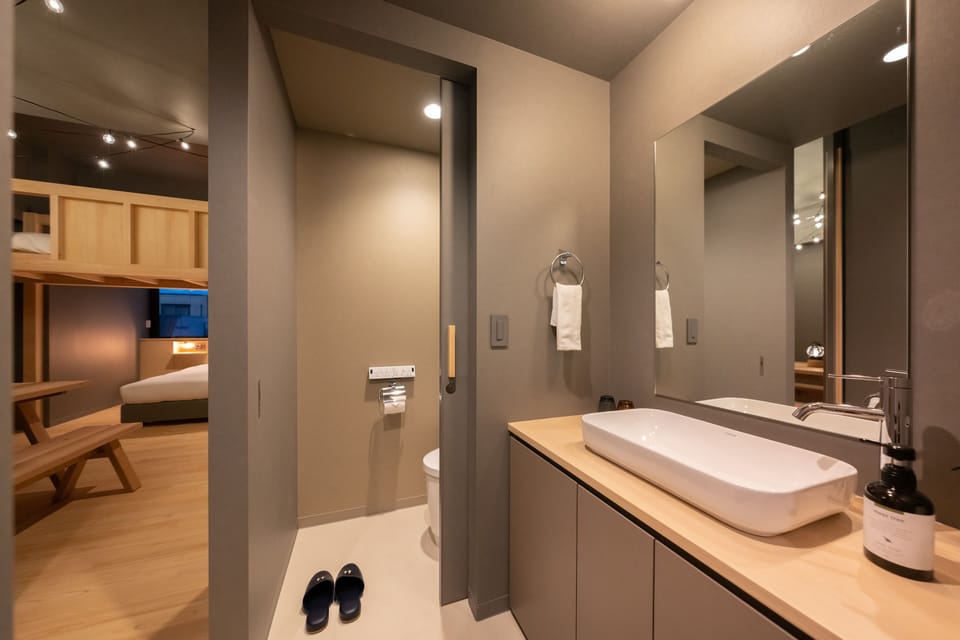 Twin Room, Non Smoking (with Loft) | Bathroom | Hair dryer, slippers, electronic bidet, towels
