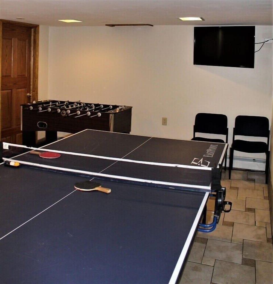 Shared game room with foosball and Ping-pong