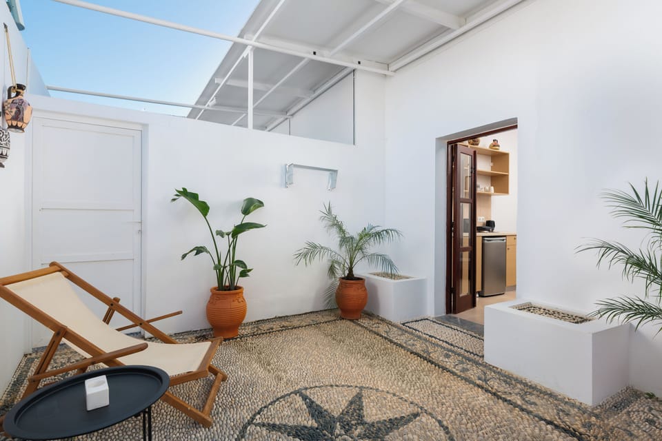 Superior One Bedroom Suite with Patio | In-room safe, laptop workspace, blackout drapes, iron/ironing board