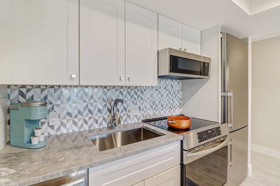 Large deep, stainless steel Kraus sink.
