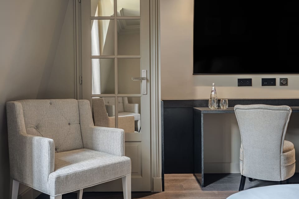 Deluxe Room | Minibar, in-room safe, blackout drapes, iron/ironing board (on request)