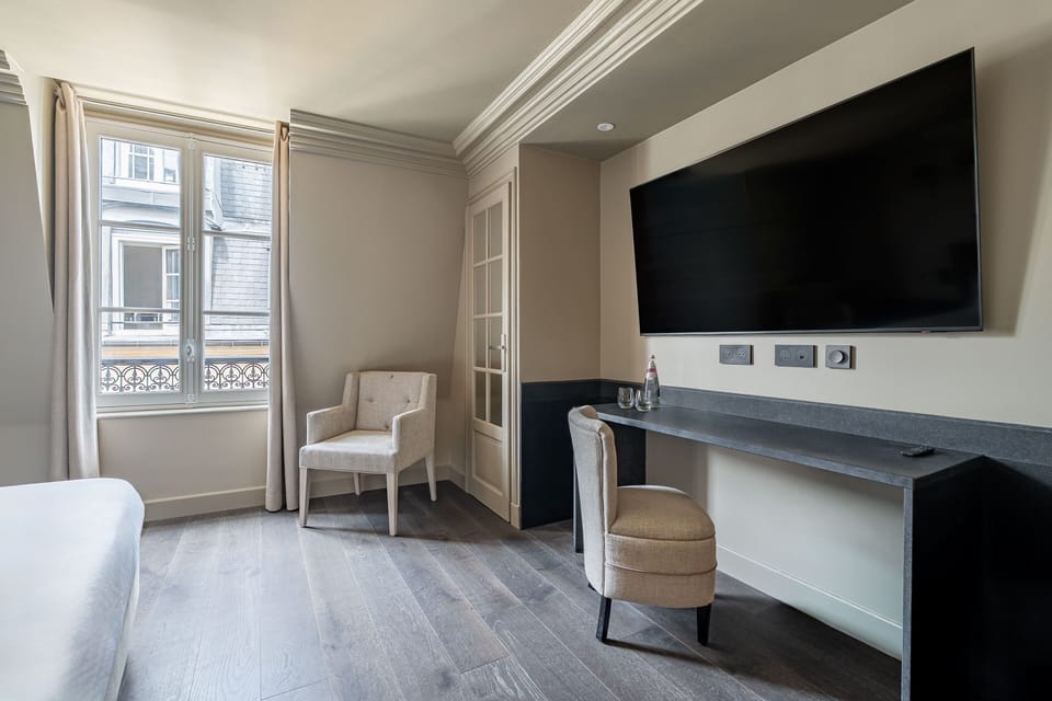 Deluxe Room | Minibar, in-room safe, blackout drapes, iron/ironing board (on request)