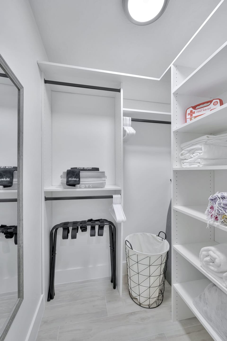 Spacious walk-in closet, complete with steamer, iron, and ron board
