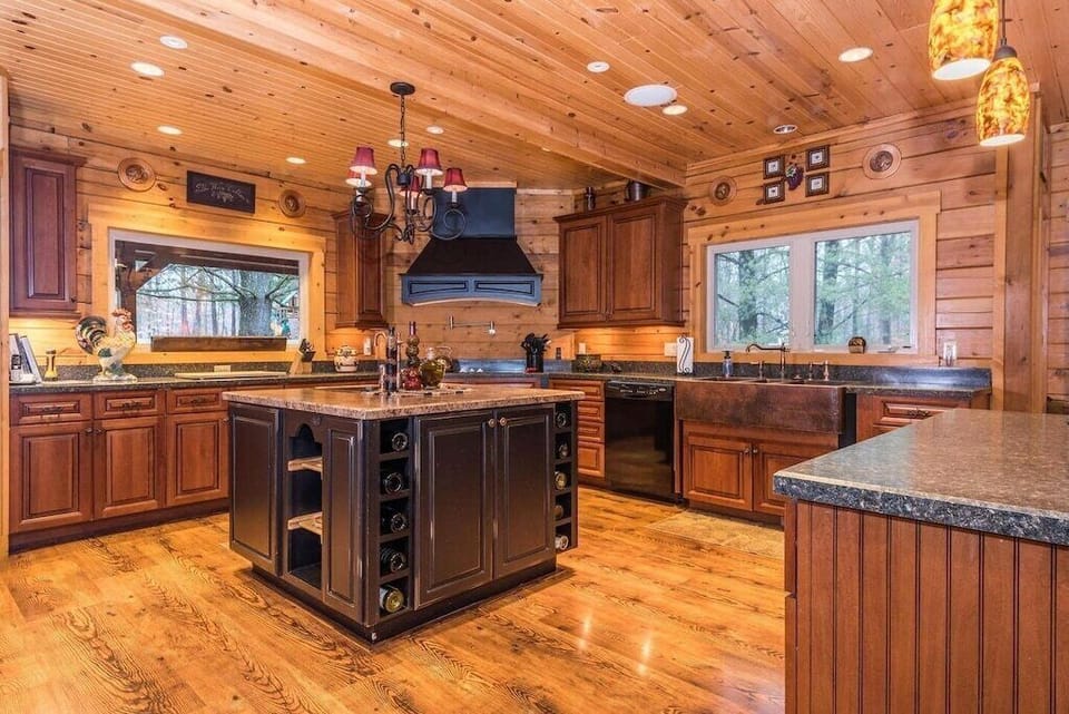 Kitchen-Main Level-We have tried to think of everything in the fully stocked gourmet kitchen.  Room for multiple cooks to prepare wonderful meals.  Two sinks, large cook top, double ovens, walk in pantry and two islands with lots of counter space.
