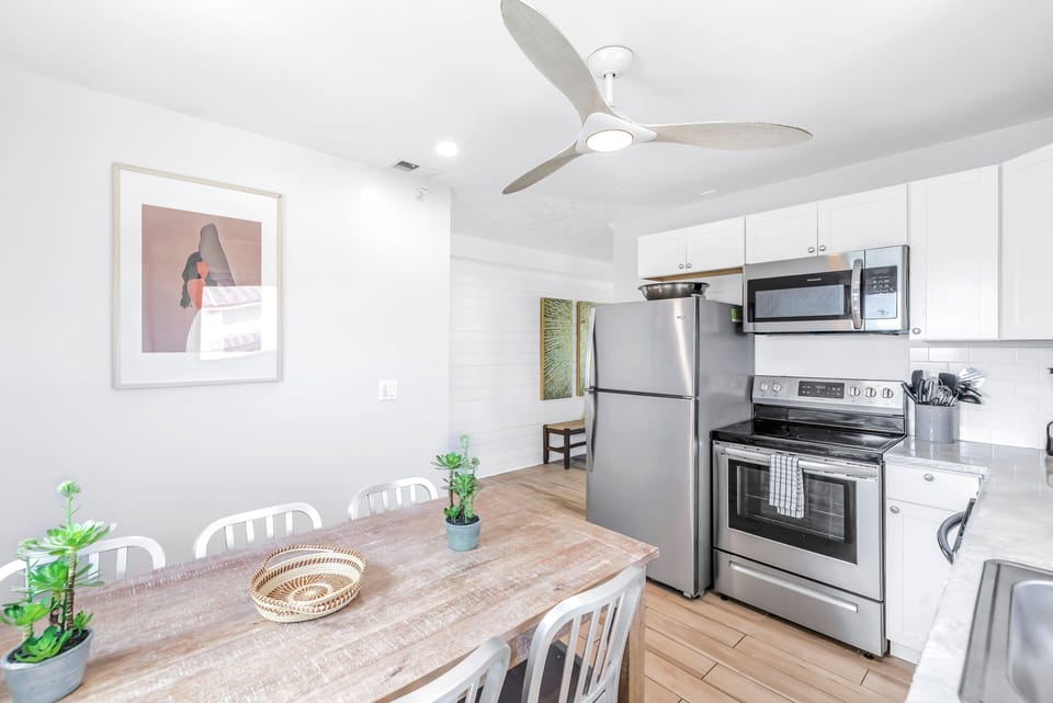 Full kitchen with full-sized fridge, oven and microwave.