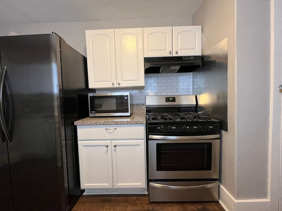 Microwave and gas stove make dining-in easy.