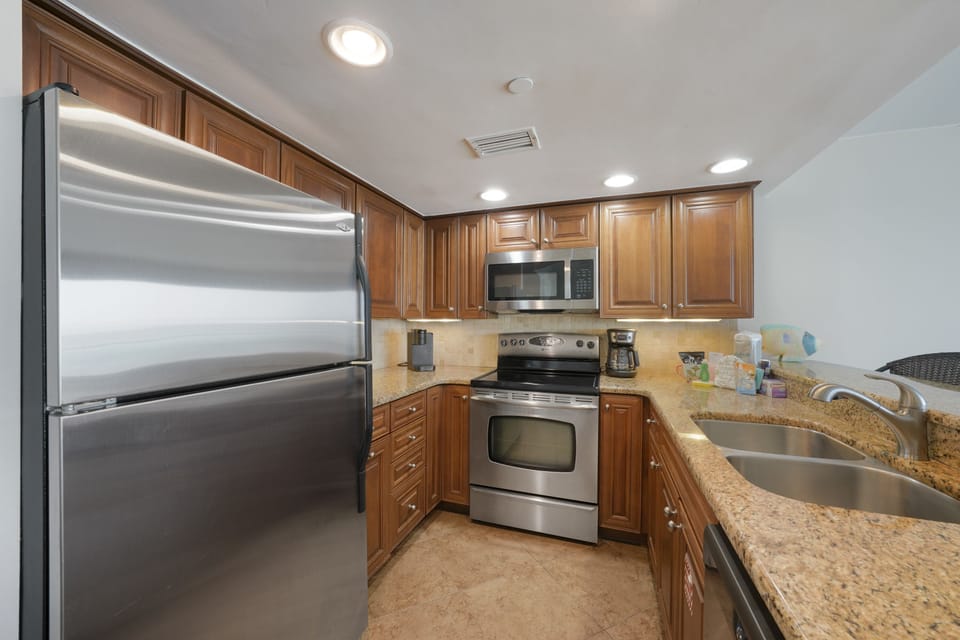 Prepare your favorite dishes with out well equipped kitchen with granite countertops and stainless appliances