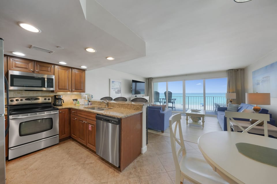 Cabana Club 205 has an open kitchen and living room with breathtaking oceanfront scenery