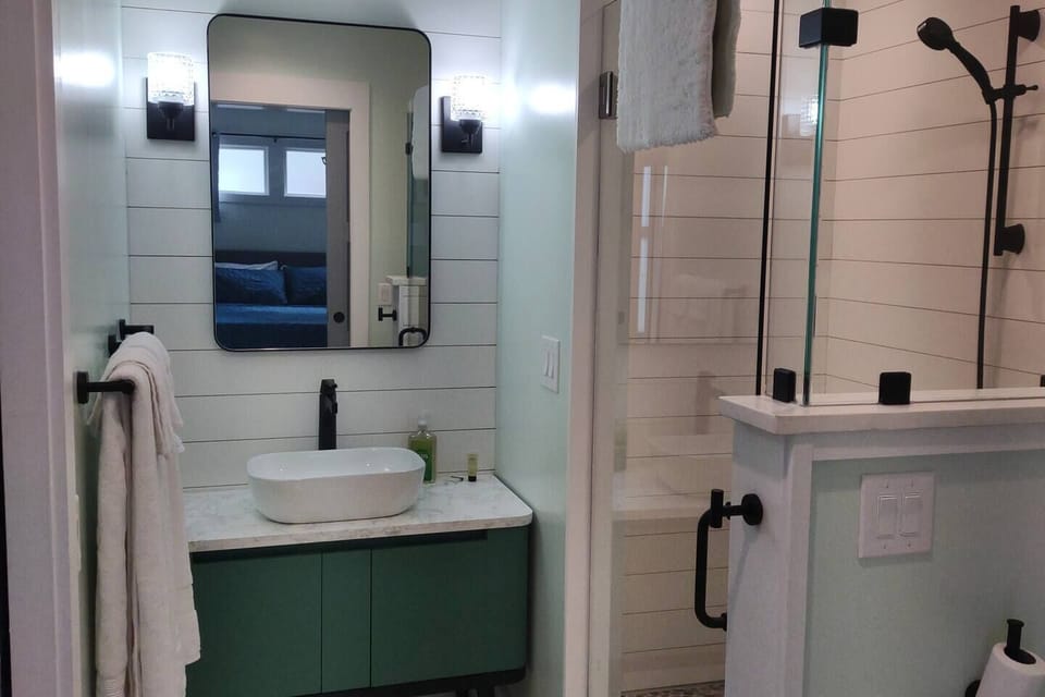 Bathroom with vessel sink, walk-in shower with rain head